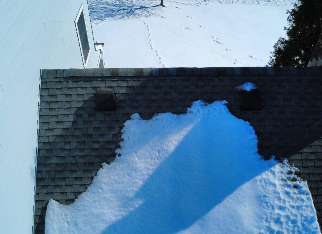 Tetti Roofing professional assessing a Somerville, NJ, home’s roof, ensuring it's ready to withstand all weather conditions