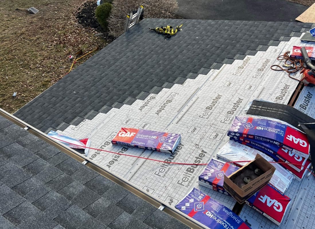 Tetti Roofing team expertly handling a roof repair in Middlesex County, ensuring customer satisfaction and longevity
